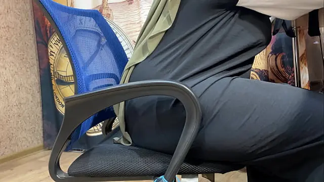 Arab woman in hijab masturbates through her panties while working