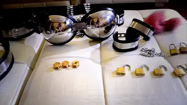 girl in female mask and  latex self-bondage Chastity belt