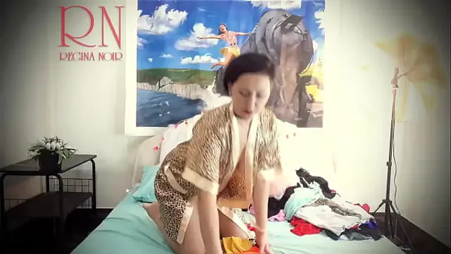 Housewife laid out sexy lingerie and outfits on the bed&period; She tries on panties&comma; corsets&comma; bras&comma; socks&comma; stockings&comma; tights&comma; peignoir&period; 1