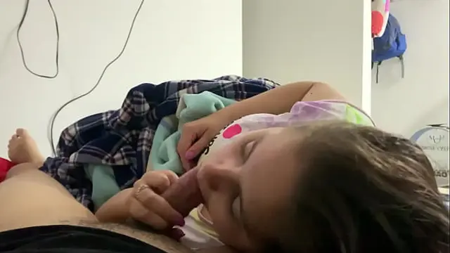 My little stepdaughter plays with my cock in her mouth while we watch a movie &lpar;She doesn't know I recorded it&rpar;